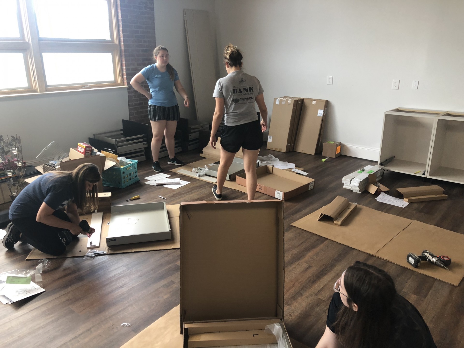 Pic3Putting Cabinets Together At Waddill 